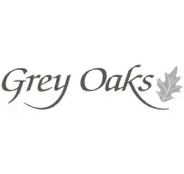 A grey oaks logo with leaves on it.